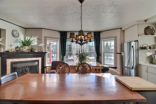 Dining room - 2169 Route Du Fleuve, Les Éboulements, QC - Indoor Photo Showing Dining Room With Fireplace