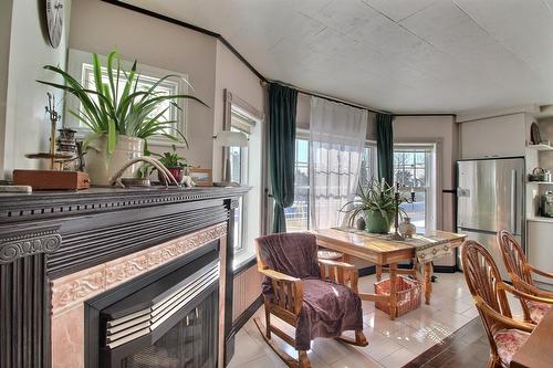 Kitchen - 2169 Route Du Fleuve, Les Éboulements, QC - Indoor With Fireplace