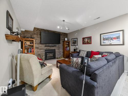 220 Ronning Cl Nw, Edmonton, AB - Indoor Photo Showing Living Room With Fireplace