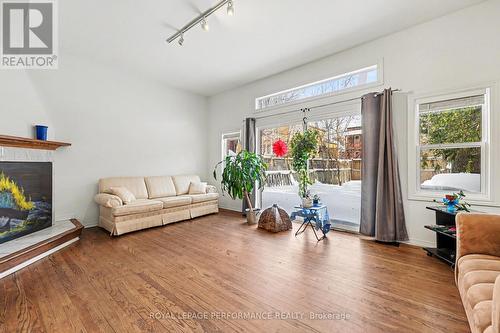 Large living room with patio doors to the yard - 157 Russell Avenue, Ottawa, ON - Indoor Photo Showing Living Room With Fireplace