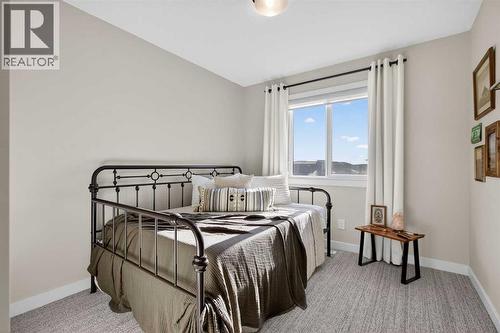 Bedroom - 35 Wolf Hollow Park Se, Calgary, AB - Indoor Photo Showing Bedroom
