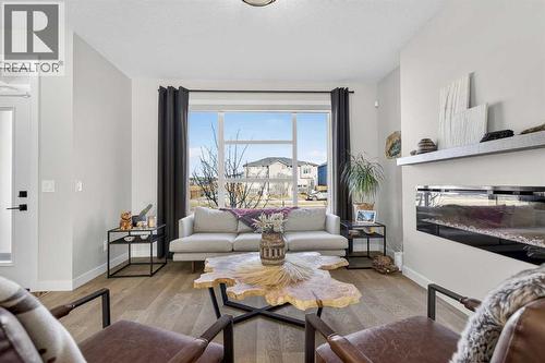 Living Room - 35 Wolf Hollow Park Se, Calgary, AB - Indoor Photo Showing Living Room With Fireplace