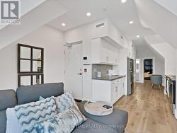 COZY LIVING ROOM WITH VAULTED CEILINGS - 