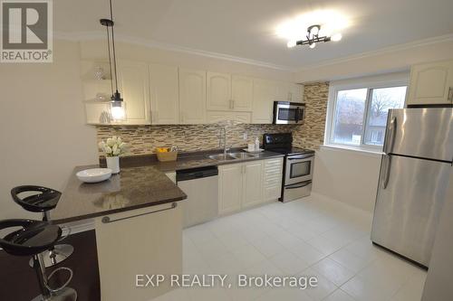 10 - 18 Moregate Crescent, Brampton, ON - Indoor Photo Showing Kitchen With Double Sink