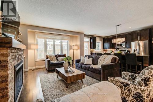 58 Eden Oak Trail, Kitchener, ON - Indoor Photo Showing Living Room With Fireplace