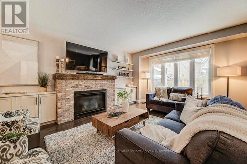 58 Eden Oak Trail, Kitchener, ON - Indoor Photo Showing Living Room With Fireplace