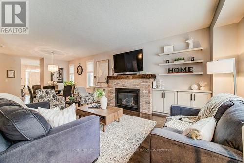 58 Eden Oak Trail, Kitchener, ON - Indoor Photo Showing Living Room With Fireplace
