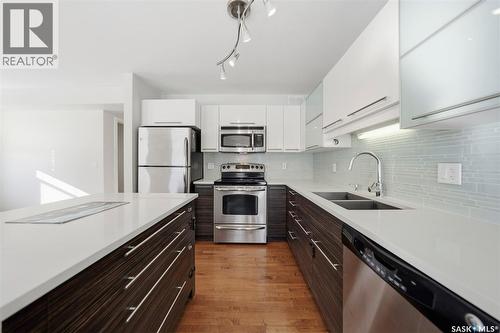 401 710 Gordon Road, Saskatoon, SK - Indoor Photo Showing Kitchen With Stainless Steel Kitchen With Double Sink With Upgraded Kitchen