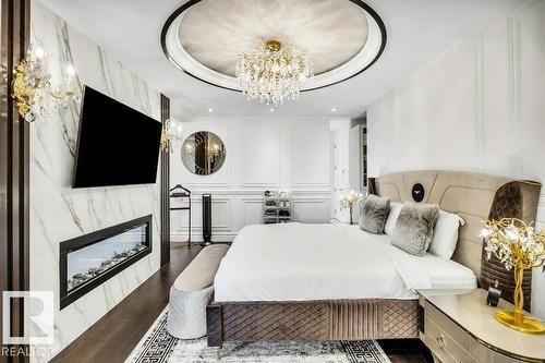 211 Windermere Dr Nw, Edmonton, AB - Indoor Photo Showing Bedroom With Fireplace