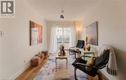Sitting room featuring wood finished floors and a textured ceiling - 