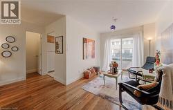 Living area with light wood finished floors and a textured ceiling - 