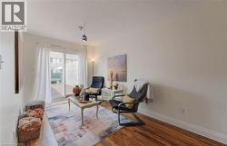 Sitting room featuring wood finished floors and a textured ceiling - 