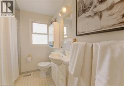 Bathroom featuring vanity and a shower with shower curtain - 