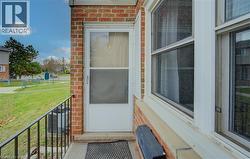 Property entrance featuring a lawn - 