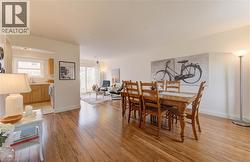 Dining space with light wood-style floors and baseboards - 