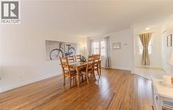 Dining space with baseboards and light wood-style floors - 