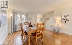Dining area featuring light wood finished floors and baseboards - 