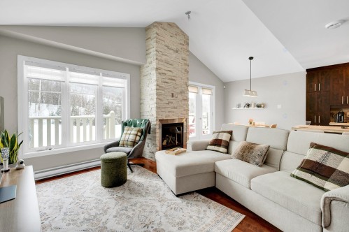 Living Room - 345 Ch. Valanza, Piedmont, QC - Indoor Photo Showing Living Room With Fireplace