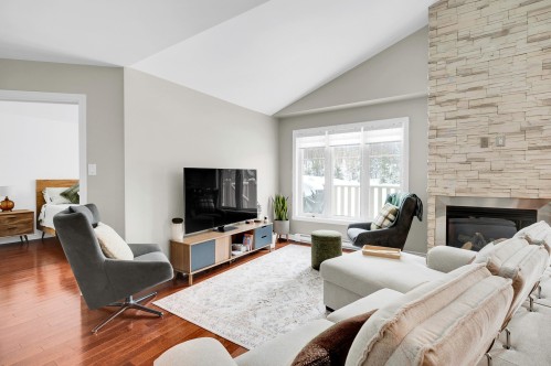 Living Room - 345 Ch. Valanza, Piedmont, QC - Indoor Photo Showing Living Room With Fireplace