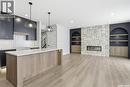 166 Cockroft Manor, Saskatoon, SK  - Indoor Photo Showing Kitchen With Fireplace With Upgraded Kitchen 
