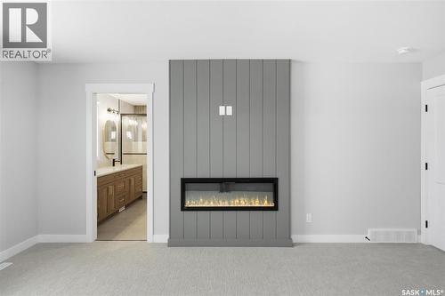 166 Cockroft Manor, Saskatoon, SK - Indoor With Fireplace