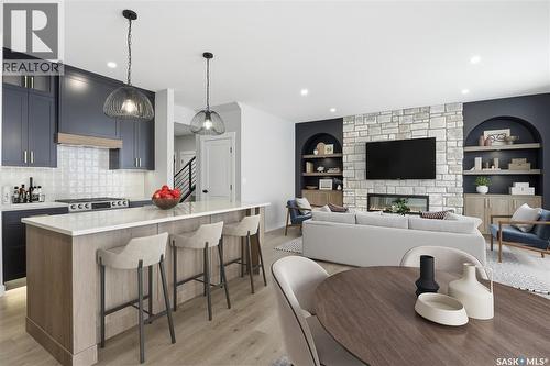 166 Cockroft Manor, Saskatoon, SK - Indoor Photo Showing Kitchen With Fireplace With Upgraded Kitchen
