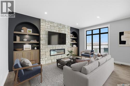 166 Cockroft Manor, Saskatoon, SK - Indoor Photo Showing Living Room With Fireplace