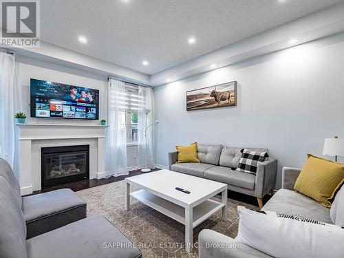325 Trudeau Drive E, Milton, ON - Indoor Photo Showing Living Room With Fireplace