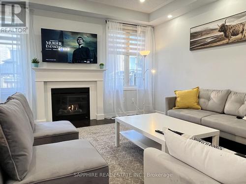 325 Trudeau Drive E, Milton, ON - Indoor Photo Showing Living Room With Fireplace