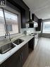118 Clancy Drive, Saskatoon, SK  - Indoor Photo Showing Kitchen With Double Sink 