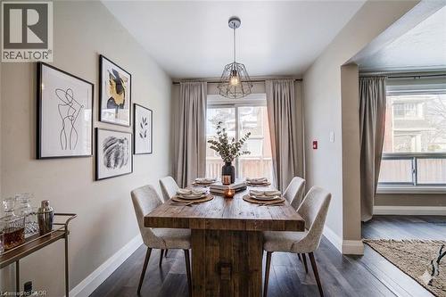 Dining area featuring dark wood-style floors and baseboards - 417 Garden Street, Cambridge, ON - Indoor Photo Showing Dining Room