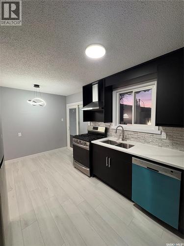 101 St Laurent Crescent, Saskatoon, SK - Indoor Photo Showing Kitchen With Double Sink