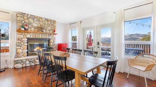 945 Westridge Way, Invermere, BC - Indoor Photo Showing Dining Room With Fireplace