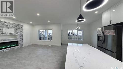 147 Woolf Bend, Saskatoon, SK - Indoor With Fireplace