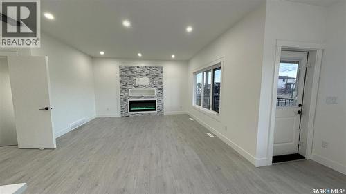 147 Woolf Bend, Saskatoon, SK - Indoor With Fireplace