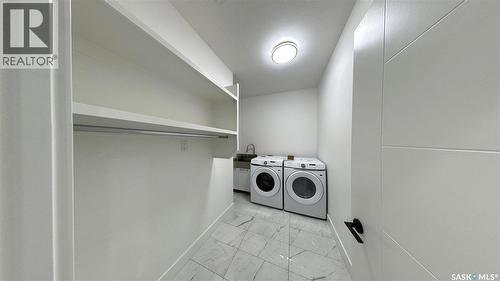 147 Woolf Bend, Saskatoon, SK - Indoor Photo Showing Laundry Room