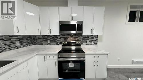 147 Woolf Bend, Saskatoon, SK - Indoor Photo Showing Kitchen With Upgraded Kitchen