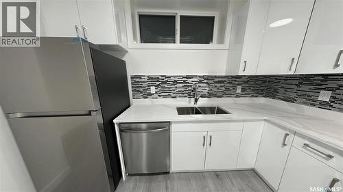 147 Woolf Bend, Saskatoon, SK - Indoor Photo Showing Kitchen With Double Sink With Upgraded Kitchen