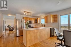 Updated kitchen with stainless steel appliances and quartz countertops - 