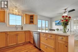 Updated kitchen with stainless steel appliances and quartz countertops - 