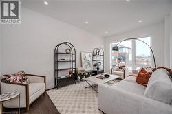 Living area featuring recessed lighting and wood finished floors - 