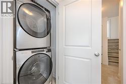Laundry area with stacked washer / drying machine - 