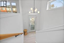 Doorway featuring a chandelier - 