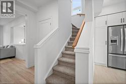 Stairway featuring baseboards and recessed lighting - 