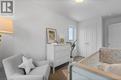 Bedroom featuring a closet and dark carpet - 