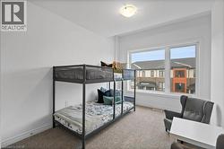 Carpeted bedroom with baseboards - 