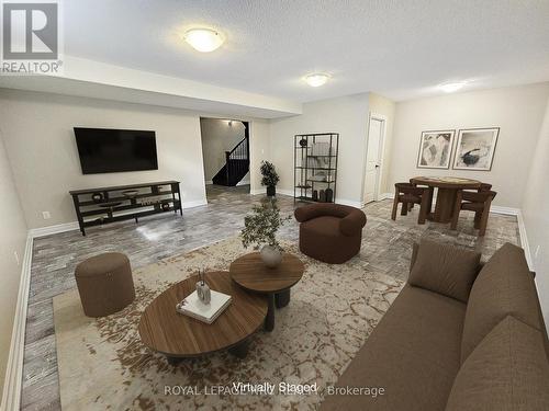 Finished lower rec room. Virtually Staged - 5784 Ironwood Street, Niagara Falls (Forestview), ON - Indoor Photo Showing Living Room