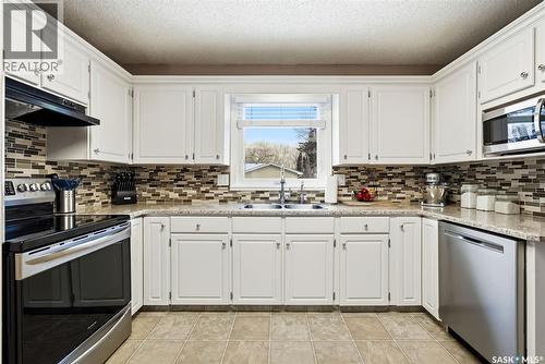 63 Champ Crescent, Regina, SK - Indoor Photo Showing Kitchen With Stainless Steel Kitchen With Double Sink