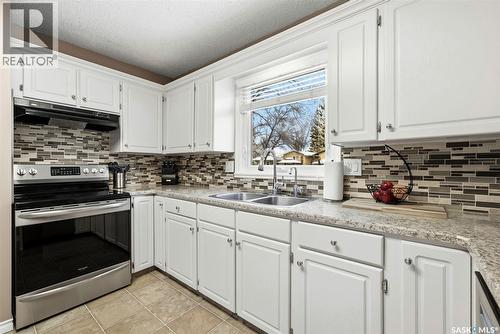 63 Champ Crescent, Regina, SK - Indoor Photo Showing Kitchen With Double Sink