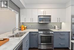 Modern Kitchen features Quartz Countertops - 